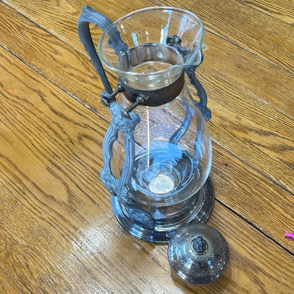 Vintage silver plated tilting coffee stand and carafe. No markings. Glass carafe